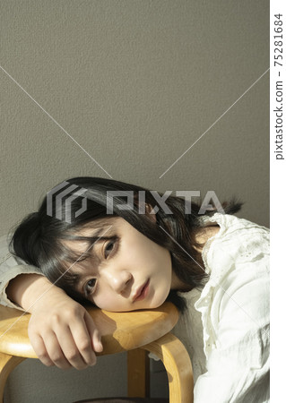 A woman relaxing in the room 75281684