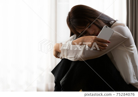 A woman holding a head A woman holding a head 75284076
