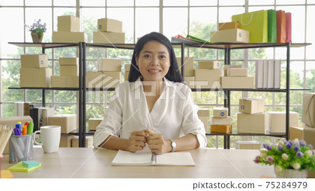 Asian business woman talking to clients on live video, selling online business. Working from home in webcam video social media in quarantine in corona virus Asian business woman talking to clients on live video, selling online business. Working from home in webcam video social media in quarantine in corona virus 75284979