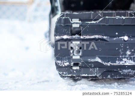 Rear suspension of a snowmobile in winter. Riding in the snow Rear suspension of a snowmobile in winter. Riding in the snow 75285124