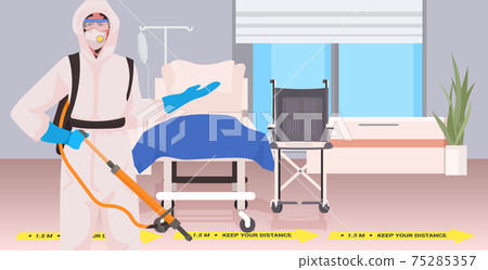 professional cleaner in hazmat suit janitor cleaning and disinfecting coronavirus cells hospital ward interior 75285357
