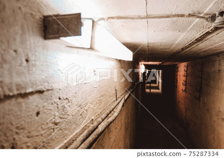 Dark corridor of old abandoned Soviet underground bunker. Defocused 75287334