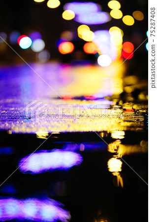 Beautiful night city lights and traffic lights, public transportation in night. Blurred background. Selective focus 75287408
