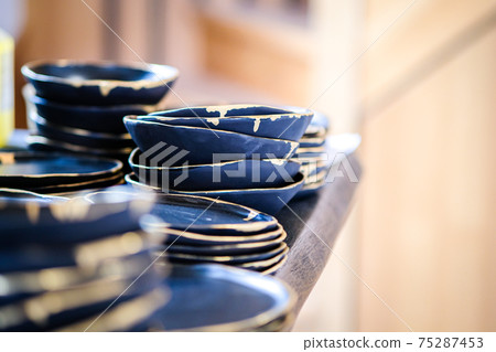 Minimalistic and futuristic high-end ceramics pottery artists workshop. Selective focus Minimalistic and futuristic high-end ceramics pottery artists workshop. Selective focus 75287453