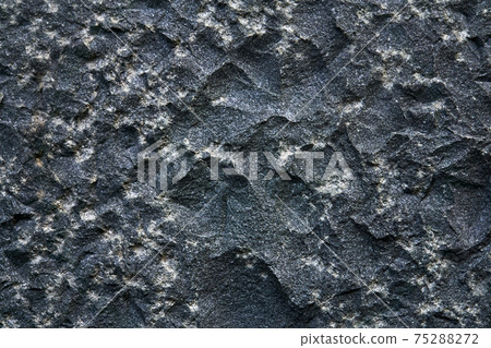 background, texture - the surface of a roughly hewn granite block 75288272