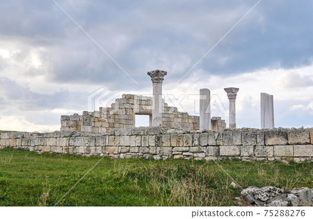 ruins of antique greek temple basilica with columns against the sky 75288276