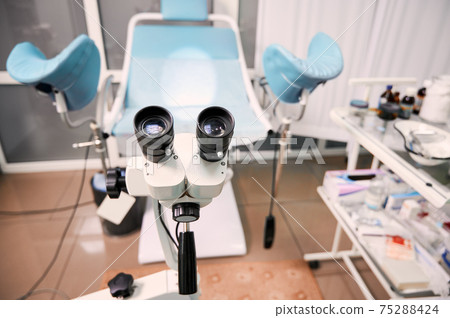 Gynecological cabinet with colposcope in modern clinic. 75288424