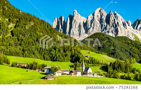 Panorama of the Dolomites with a chruch at Santa Maddalena in Italy 75291168