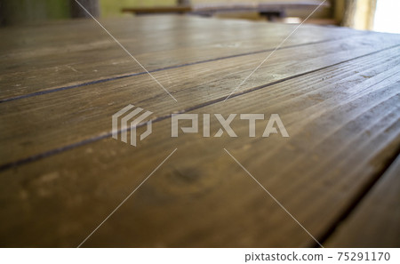 Wooden table close up Wooden table with sun light, close up Wooden table close up Wooden table with sun light, close up 75291170
