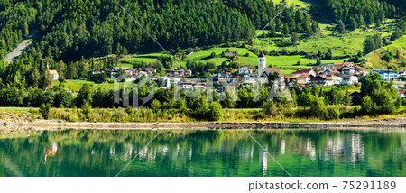 Graun im Vinschgau or Curon Venosta, a town on Lake Reschen in South Tyrol, Italy Graun im Vinschgau or Curon Venosta, a town on Lake Reschen in South Tyrol, Italy 75291189