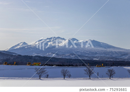 Winter Hakkoda and highway snow melting agent sprayer seen from the suburbs of Aomori Winter Hakkoda and highway snow melting agent sprayer seen from the suburbs of Aomori 75291681
