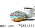 View of a sweet donut with blue icing and crushed candies. 75291849