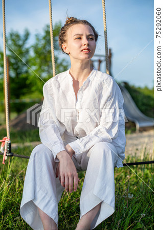 White girl with blonde hair outside 75292060