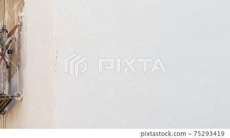 Facade painting scaffolding and painters on the wall with text space on the right 75293419