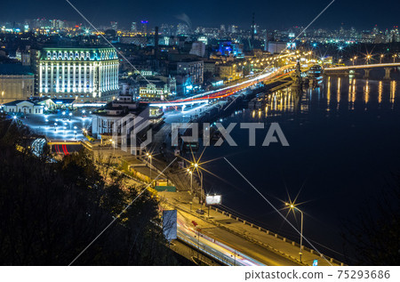 Evening cityscape. Night landscape of a big city. The city on the river. Postal area, Kyiv, Ukraine. Evening cityscape. Night landscape of a big city. The city on the river. Postal area, Kyiv, Ukraine. 75293686