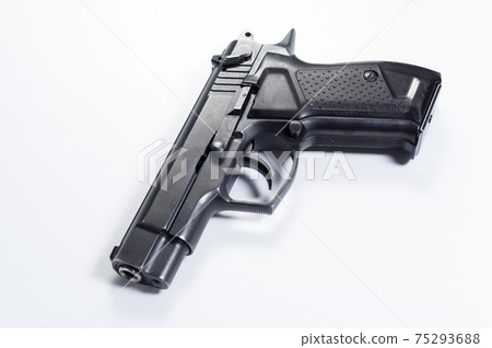 Fire pistol at an angle. Pistol on a gray background. Fire pistol at an angle. Pistol on a gray background. 75293688