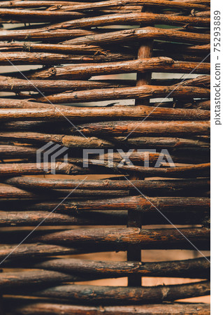 Organic woven willow wicker fence panel suitable for crafts, picnic or gardening background. 75293889