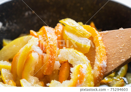 Making orange peel, boiled in sugar and water Making orange peel, boiled in sugar and water 75294603