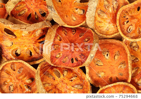 Background of slices dried bael fruit. 75294668