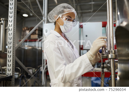 Female Worker at Chemical or Pharmaceutical Plant Female Worker at Chemical or Pharmaceutical Plant 75296034
