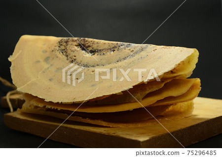 Indonesian Snacks, Leker cake. Its is thin, sweet, semicircular and delicious Indonesian Snacks, Leker cake. Its is thin, sweet, semicircular and delicious 75296485