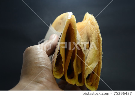 Indonesian Snacks, Leker cake. Its is thin, sweet, semicircular and delicious Indonesian Snacks, Leker cake. Its is thin, sweet, semicircular and delicious 75296487
