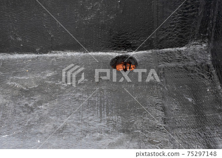 rainwater drain. Flat roof drain close up rainwater drain. Flat roof drain close up 75297148