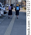 Elementary school students go to school in the morning 75297227