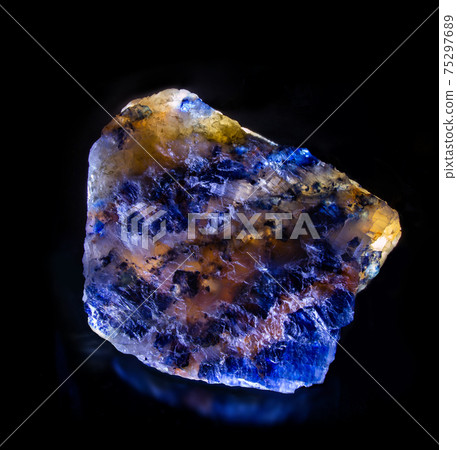 Shiny luminous blue sylvinite rock salt mineral crystal from Soligorsk, Belarus. A photo isolated on black. Geology mineralogy websites, stone collection catalog, Natural Science museum wall chart. Shiny luminous blue sylvinite rock salt mineral crystal from Soligorsk, Belarus. A photo isolated on black. Geology mineralogy websites, stone collection catalog, Natural Science museum wall chart. 75297689