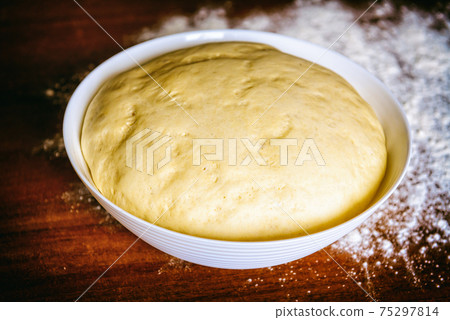 Preparing dough for bread 75297814