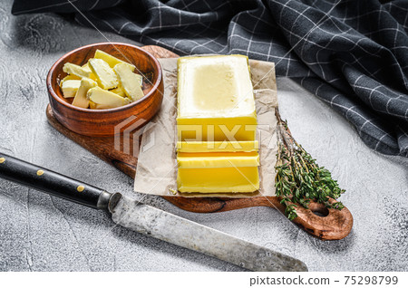 Block of fresh Butter, dairy farm products. Gray background.Top view 75298799