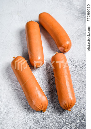 Raw barbecue sausages bratwurst on a table. White background. top view 75299010