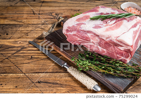 Pork Neck raw meat piece on wooden cutting board. wooden background. Top  view Stock Photo by composter-box