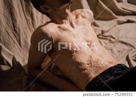 Man enjoying weekend lazy time alone at home, while daydreaming at fabric 75299351