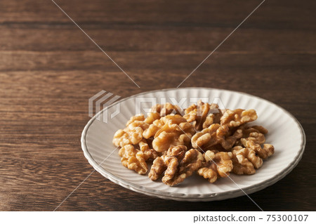 Walnuts served in a plate Walnuts served in a plate 75300107