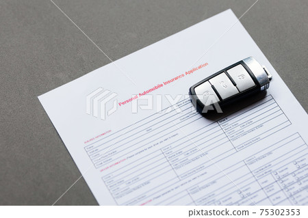 car insurance policy and keys from car 75302353