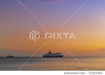Passenger ship sailing to city seaport at sunset in Thessaloniki, Greece. 75303491