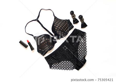 Flat lay black lingerie and accessories isolated on white background 75305421