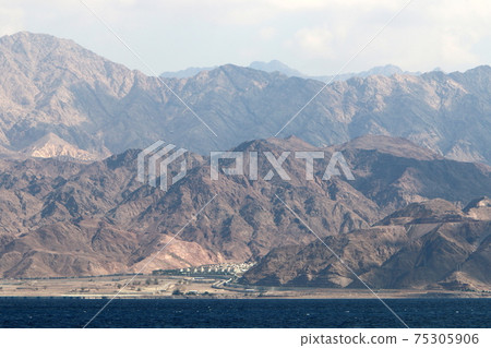 Jordan on the other side of the Gulf of Eilat. Photo taken from the side of Israel Jordan on the other side of the Gulf of Eilat. Photo taken from the side of Israel 75305906