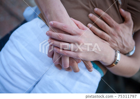 Loving couple holding hands close-up. Love concept 75311797