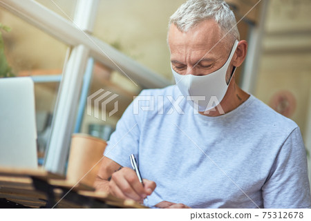 Middle aged caucasian man in protective mask Middle aged caucasian man in protective mask 75312678