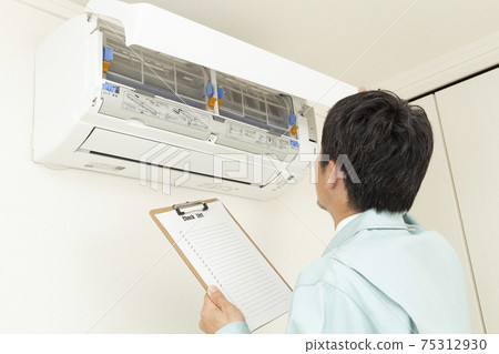 Workers inspecting air conditioners Workers inspecting air conditioners 75312930