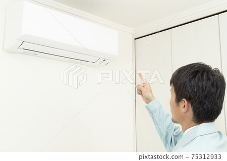 Workers inspecting air conditioners 75312933