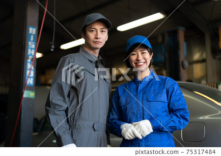 Auto mechanic working in a factory Auto mechanic working in a factory 75317484