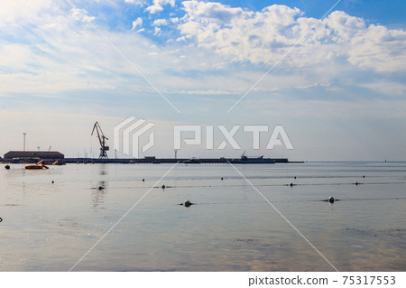 View of sea port and the Black sea in Skadovsk, Ukraine View of sea port and the Black sea in Skadovsk, Ukraine 75317553