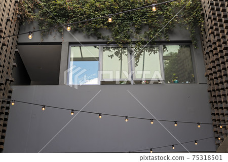 Apartment Exterior Strung With Lights 75318501