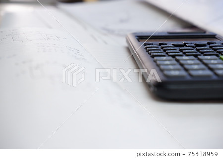 Handwritten notebook, scientific calculator, calculation practice, study, qualification acquisition image Handwritten notebook, scientific calculator, calculation practice, study, qualification acquisition image 75318959