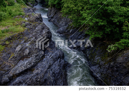 The giant rocks of Kinsenkyo Gorge in Takinoe Town and the Shokotsu River 75319332