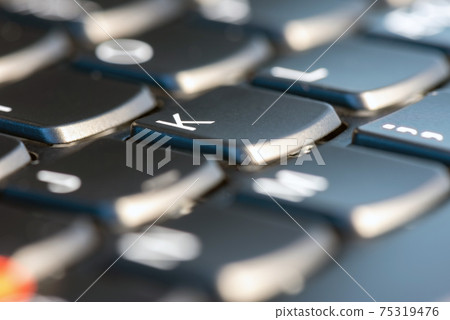 Macro shot of black keyboard focus on K key Macro shot of black keyboard focus on K key 75319476