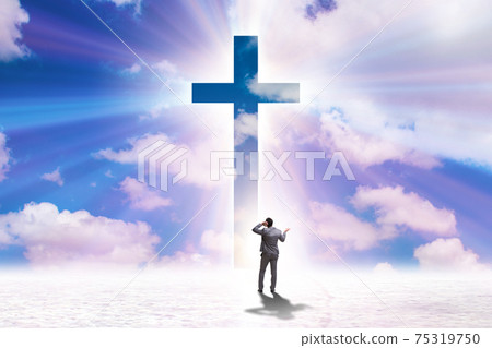 Religious concept with cross and lonely man 75319750